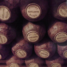 Moore & Bode eschews cigar bands, and instead puts a small, circular label on the head of the cigar.
